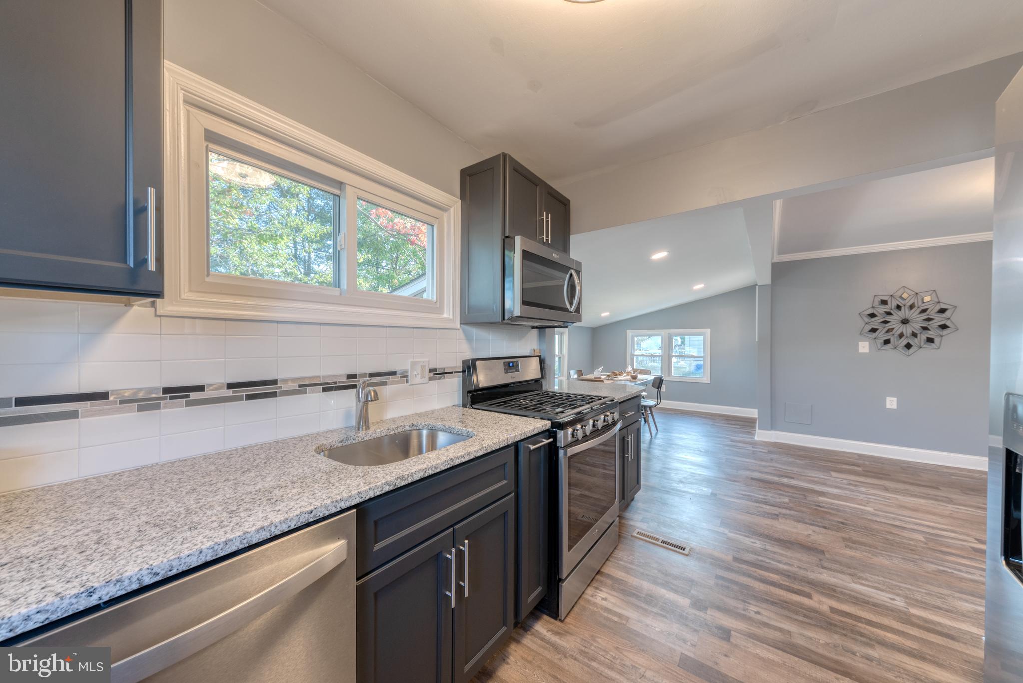 8722 Roper Road Baltimore, MD 21234 - Photo 10 of 23 More natural light and tasteful backsplash