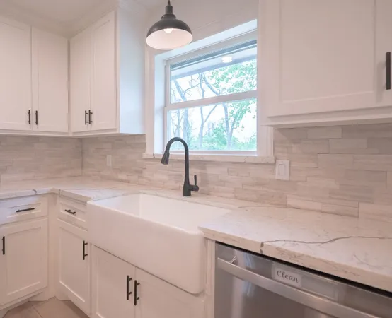 a kitchen with a sink and cabinets
