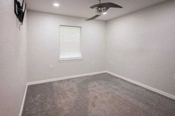 an empty room with a bathroom