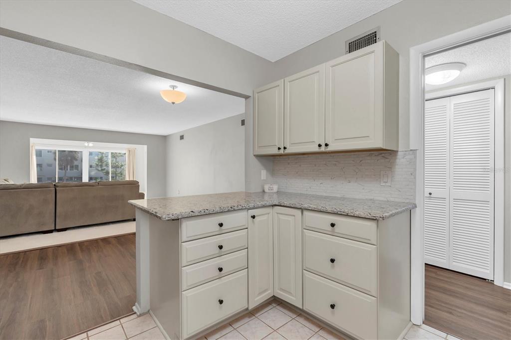 2417 Persian Drive, Unit 23 Clearwater, FL 33763 - Photo 16 of 48 a view of cabinets and window