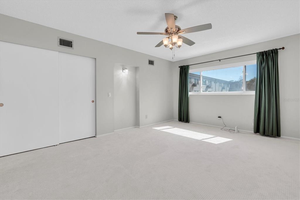 2417 Persian Drive, Unit 23 Clearwater, FL 33763 - Photo 18 of 48 a view of an empty room with a window