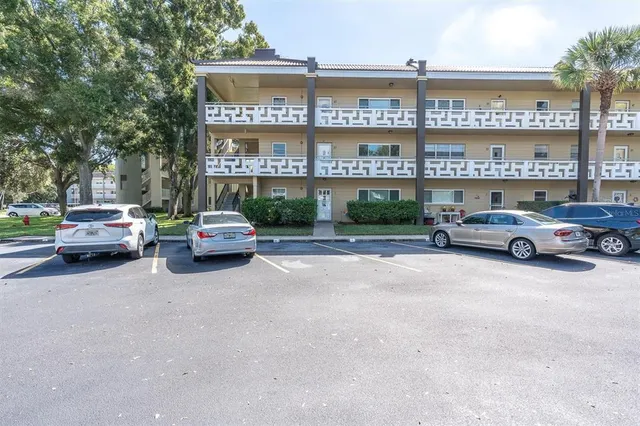 a building with cars parked in front of it