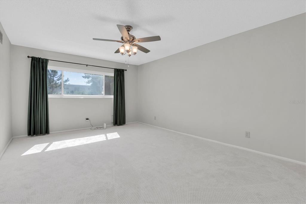 2417 Persian Drive, Unit 23 Clearwater, FL 33763 - Photo 24 of 48 a view of an empty room with a window