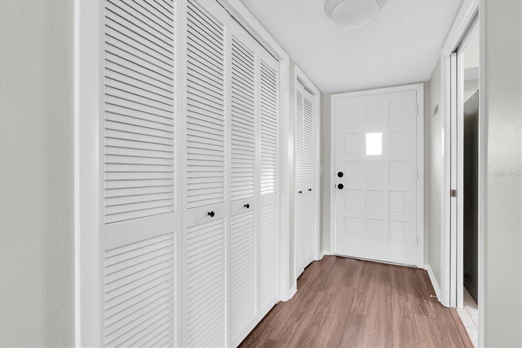 2417 Persian Drive, Unit 23 Clearwater, FL 33763 - Photo 4 of 48 a view of a hallway with wooden floor