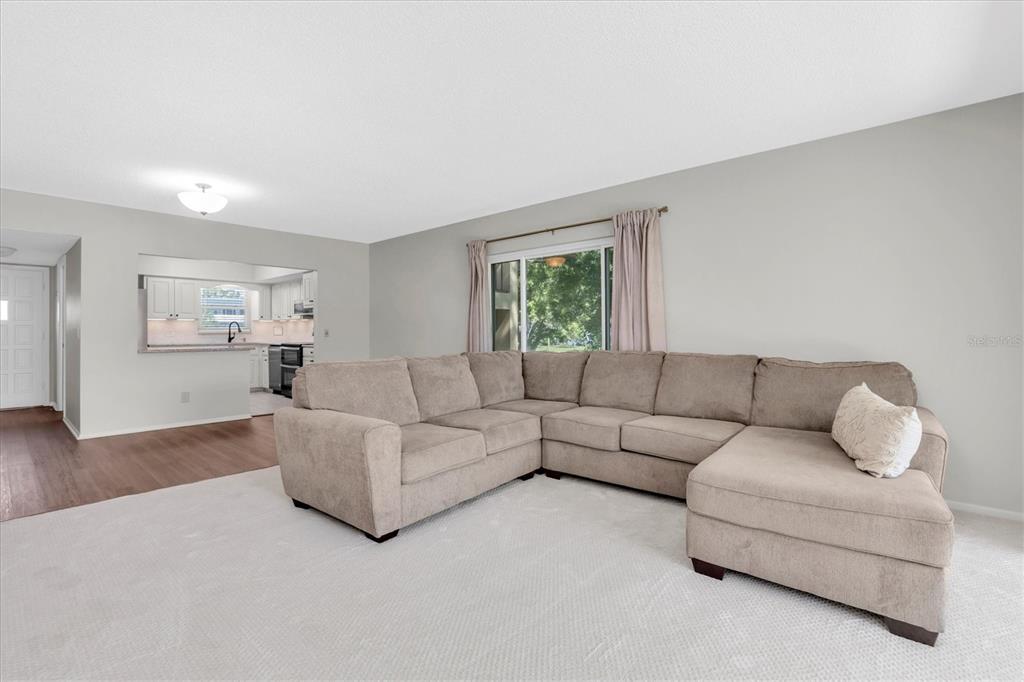 2417 Persian Drive, Unit 23 Clearwater, FL 33763 - Photo 7 of 48 a living room with furniture and a couch