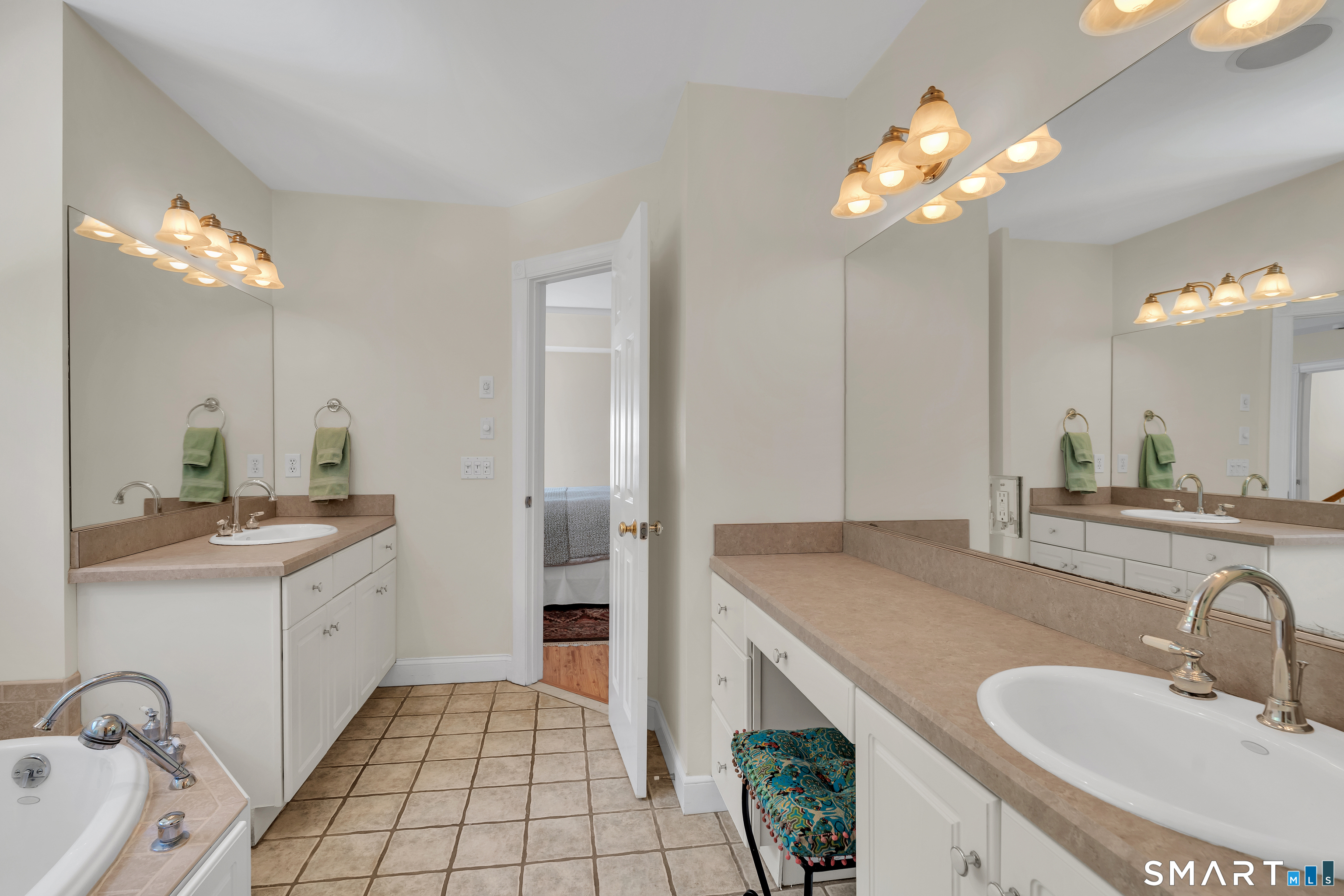 21 Stone Wall Road Salem, CT 06420 - Photo 21 of 38 a bathroom with a sink double vanity and a mirror