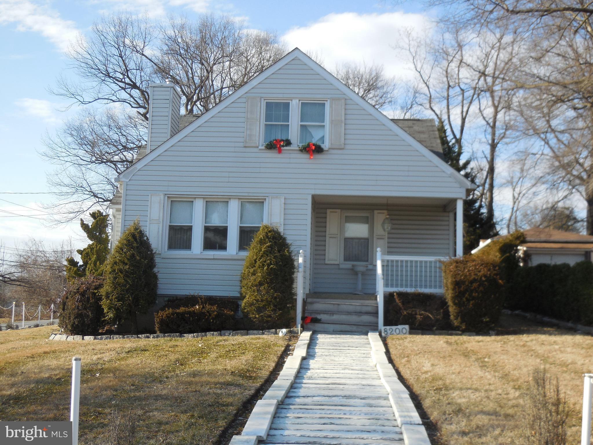 8200 Philadelphia Road Baltimore, MD 21237 - Photo 3 of 41 a front view of a house with a yard