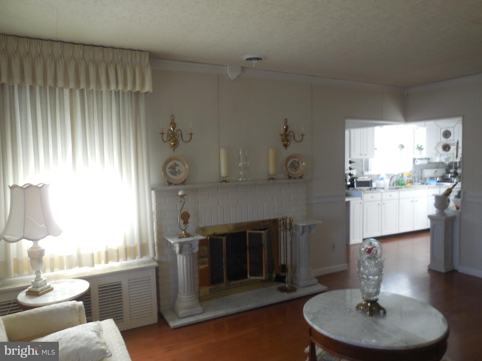 8200 Philadelphia Road Baltimore, MD 21237 - Photo 23 of 41 a living room with furniture and a fireplace