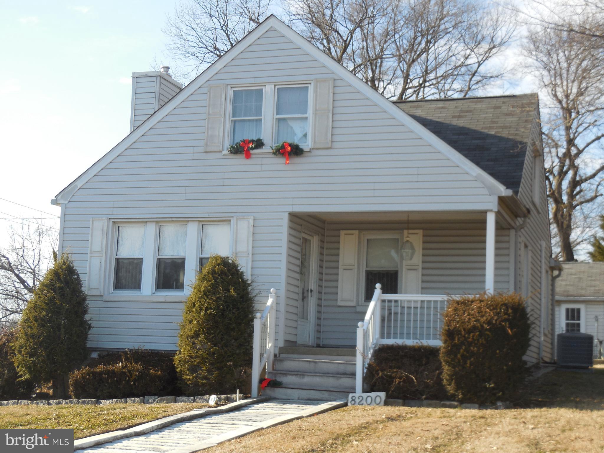 8200 Philadelphia Road Baltimore, MD 21237 - Photo 5 of 41 a front view of a house with garden
