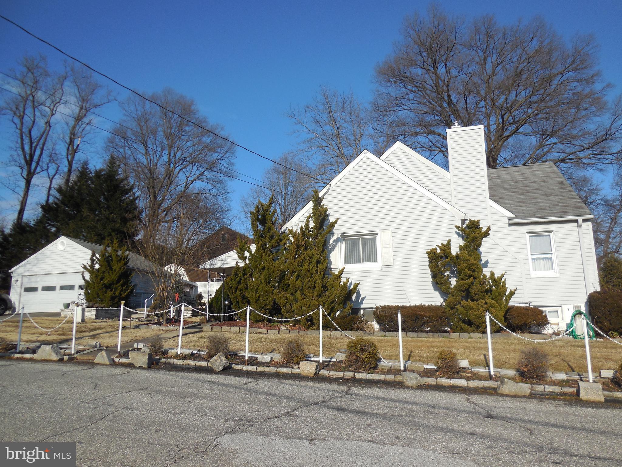 8200 Philadelphia Road Baltimore, MD 21237 - Photo 6 of 41 a view of a white house with a yard