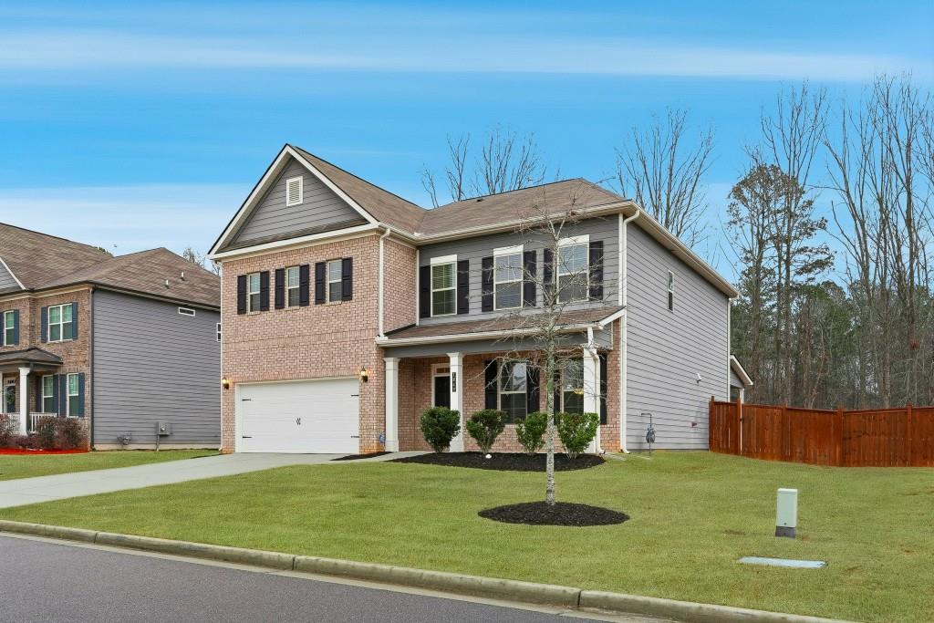 1849 Hanwoo Lane Powder Springs, GA 30127 - Photo 3 of 47 a front view of a house with a yard