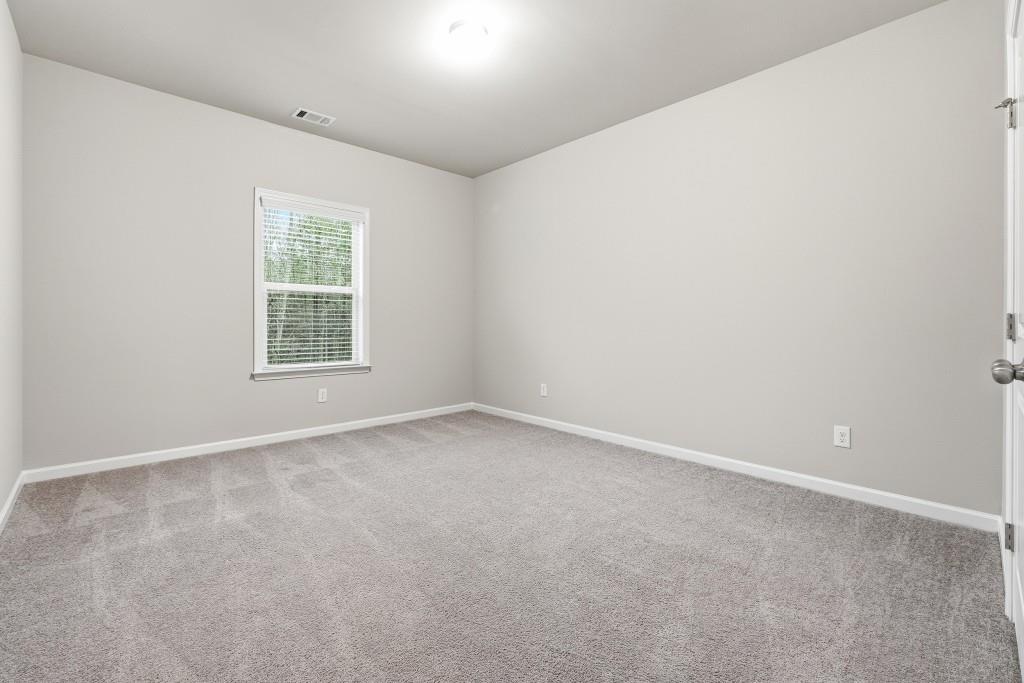 1849 Hanwoo Lane Powder Springs, GA 30127 - Photo 34 of 47 an empty room with a window
