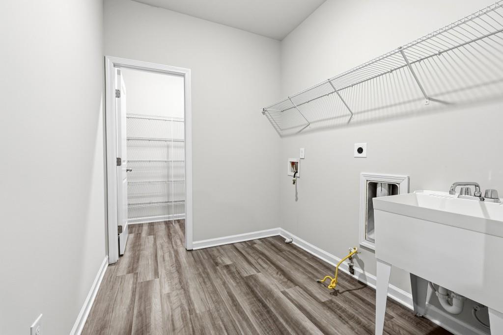 1849 Hanwoo Lane Powder Springs, GA 30127 - Photo 36 of 47 a view of a room with wooden floor and cabinet