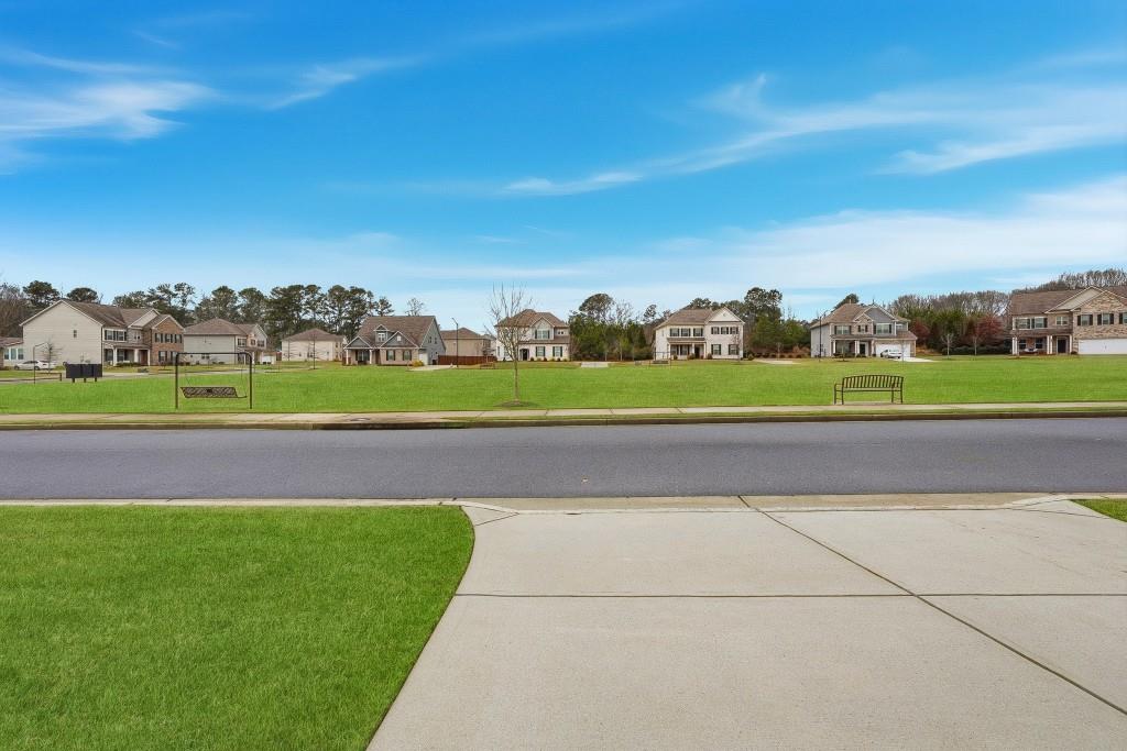 1849 Hanwoo Lane Powder Springs, GA 30127 - Photo 4 of 47 a view of a golf course with a field