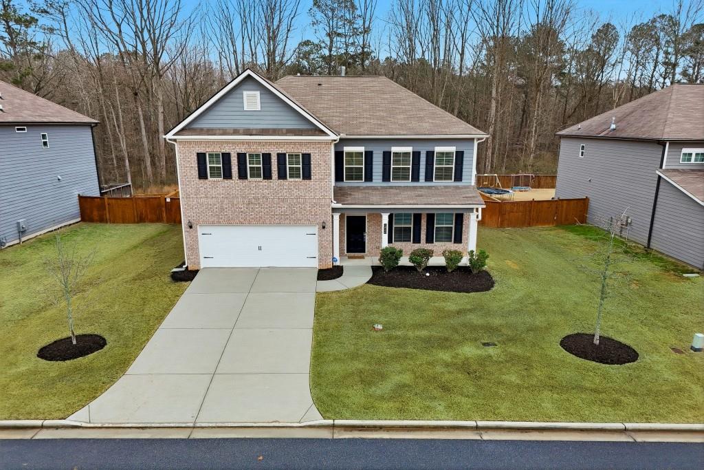 1849 Hanwoo Lane Powder Springs, GA 30127 - Photo 41 of 47 a front view of a house with yard