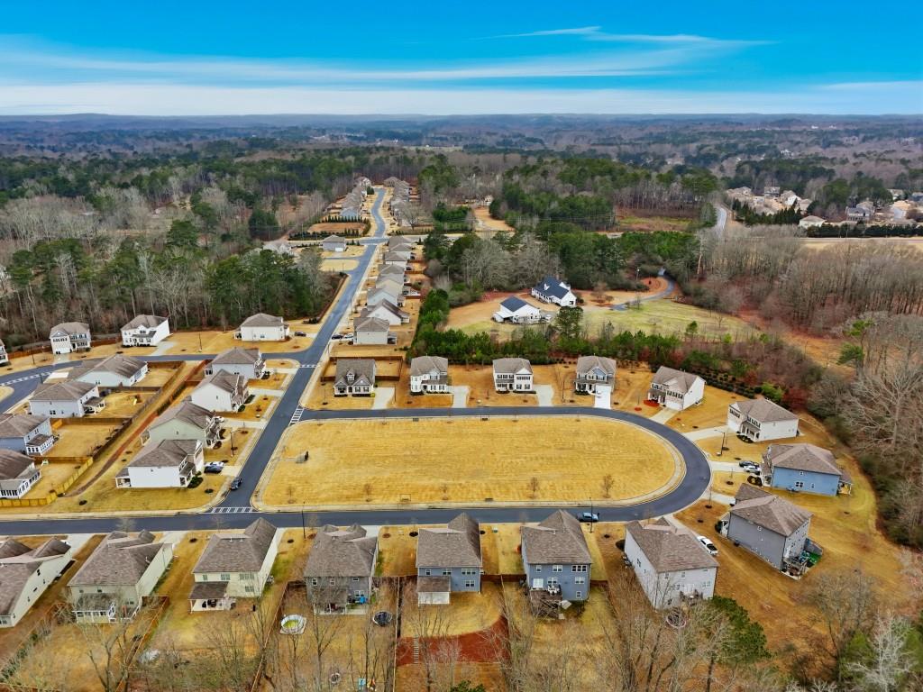 1849 Hanwoo Lane Powder Springs, GA 30127 - Photo 45 of 47 an aerial view of residential houses with outdoor space