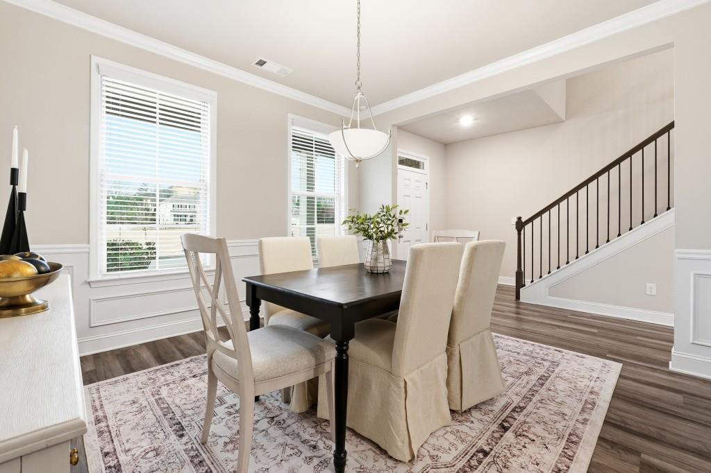 1849 Hanwoo Lane Powder Springs, GA 30127 - Photo 9 of 47 a view of a dining room with furniture window and wooden floor