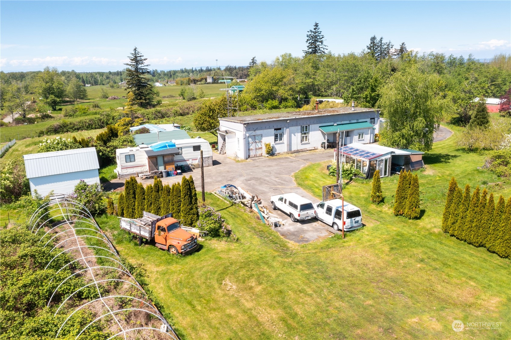 7150 Telstar Road Ferndale, WA 98248 - Photo 2 of 15 an aerial view of a house with swimming pool outdoor seating and yard