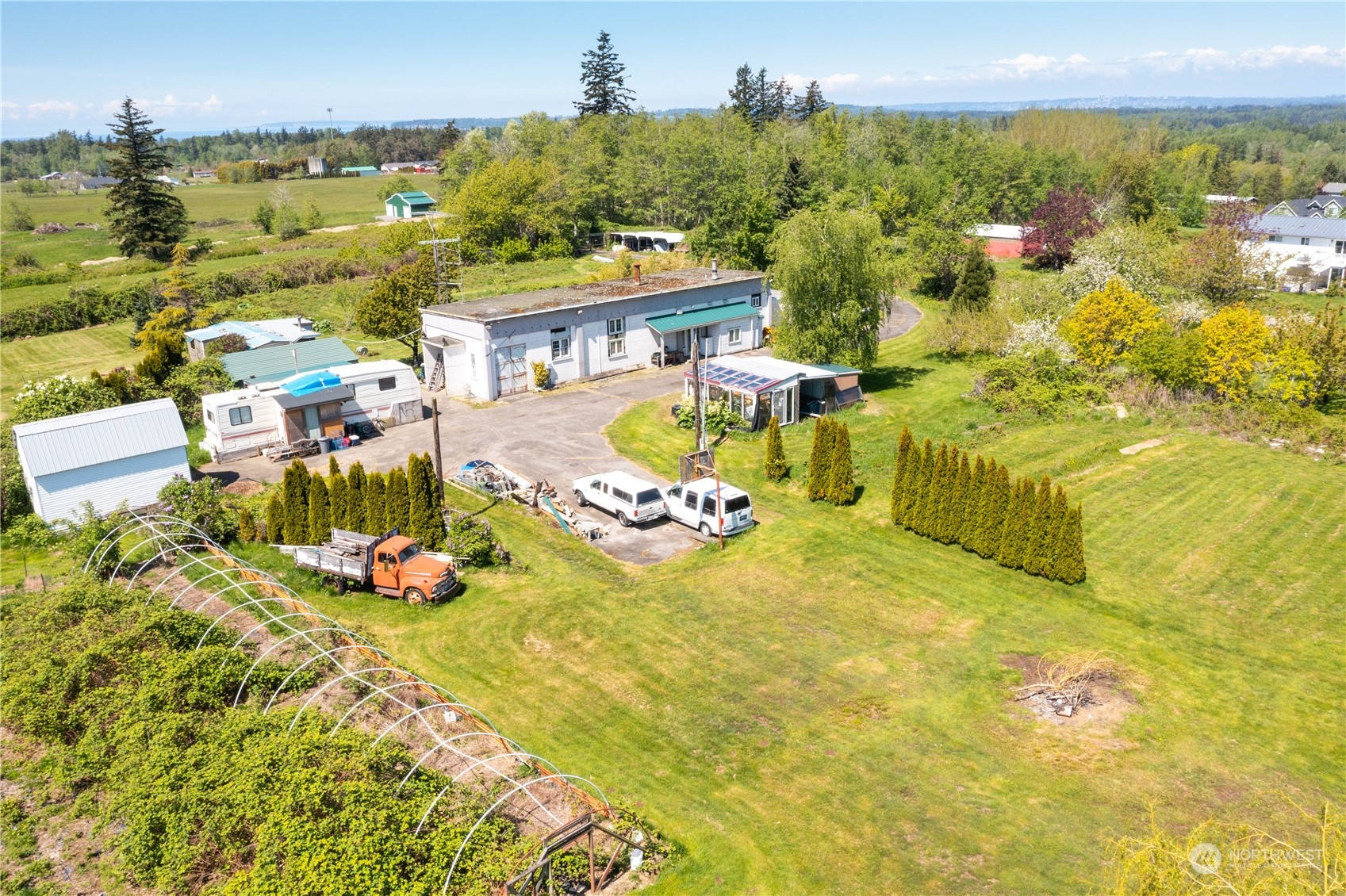 7150 Telstar Road Ferndale, WA 98248 - Photo 3 of 15 a view of a swimming pool with an outdoor seating and a yard