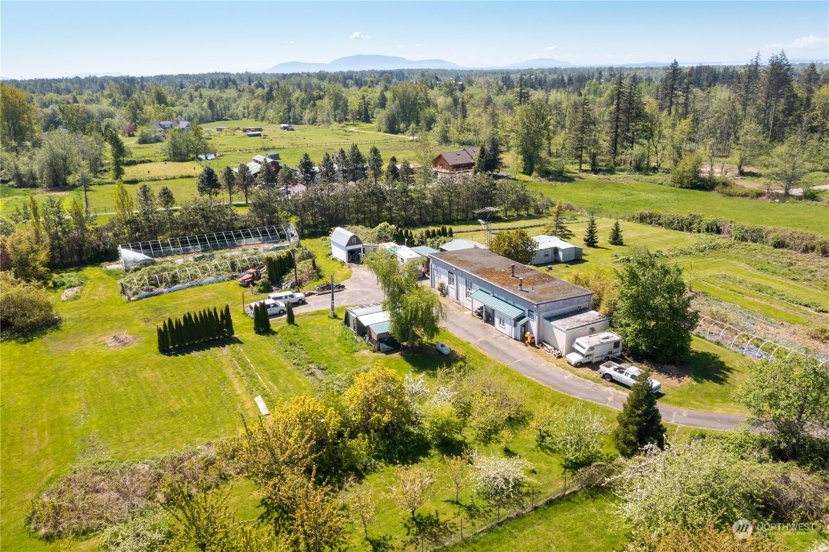 7150 Telstar Road Ferndale, WA 98248 - Photo 5 of 15 an aerial view of residential houses with outdoor space and swimming pool