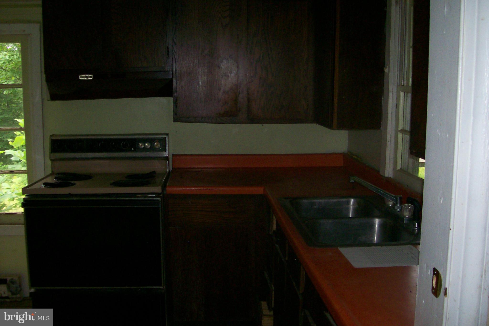 114 Moorehead Road Gore, VA 22637 - Photo 15 of 25 a kitchen with a sink and cabinets