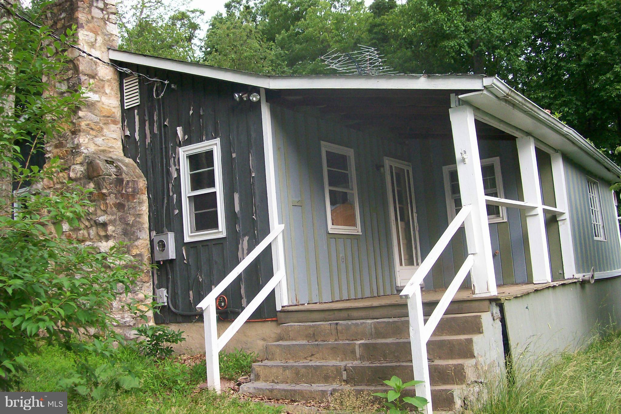 114 Moorehead Road Gore, VA 22637 - Photo 5 of 25 a front view of a house with a yard