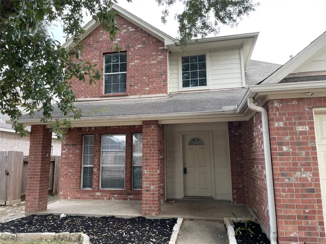 a front view of a house with glass windows