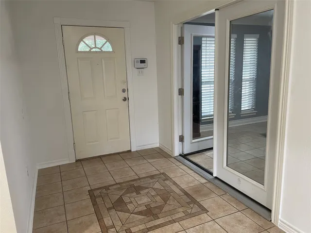 a view of a hallway view with staircase