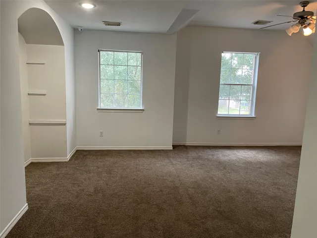 an empty room with windows