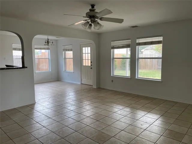 a view of entryway and kitchen with chandelier