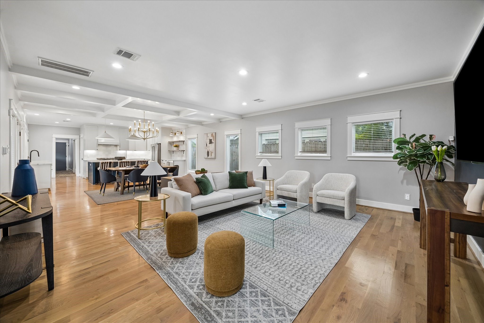 1205 Temple Street Houston, TX 77009 - Photo 10 of 33 The heart of the home is both elegant and inviting—an expansive gathering space where oversized windows, soaring ceilings, and thoughtful design create an atmosphere that's equally suited for lively entertaining and quiet evenings.