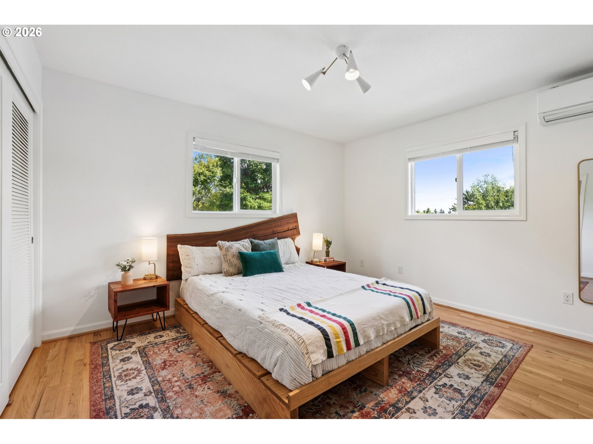 7225 Southwest 13th Avenue Portland, OR 97219 - Photo 20 of 48 a bedroom with a large bed and a window