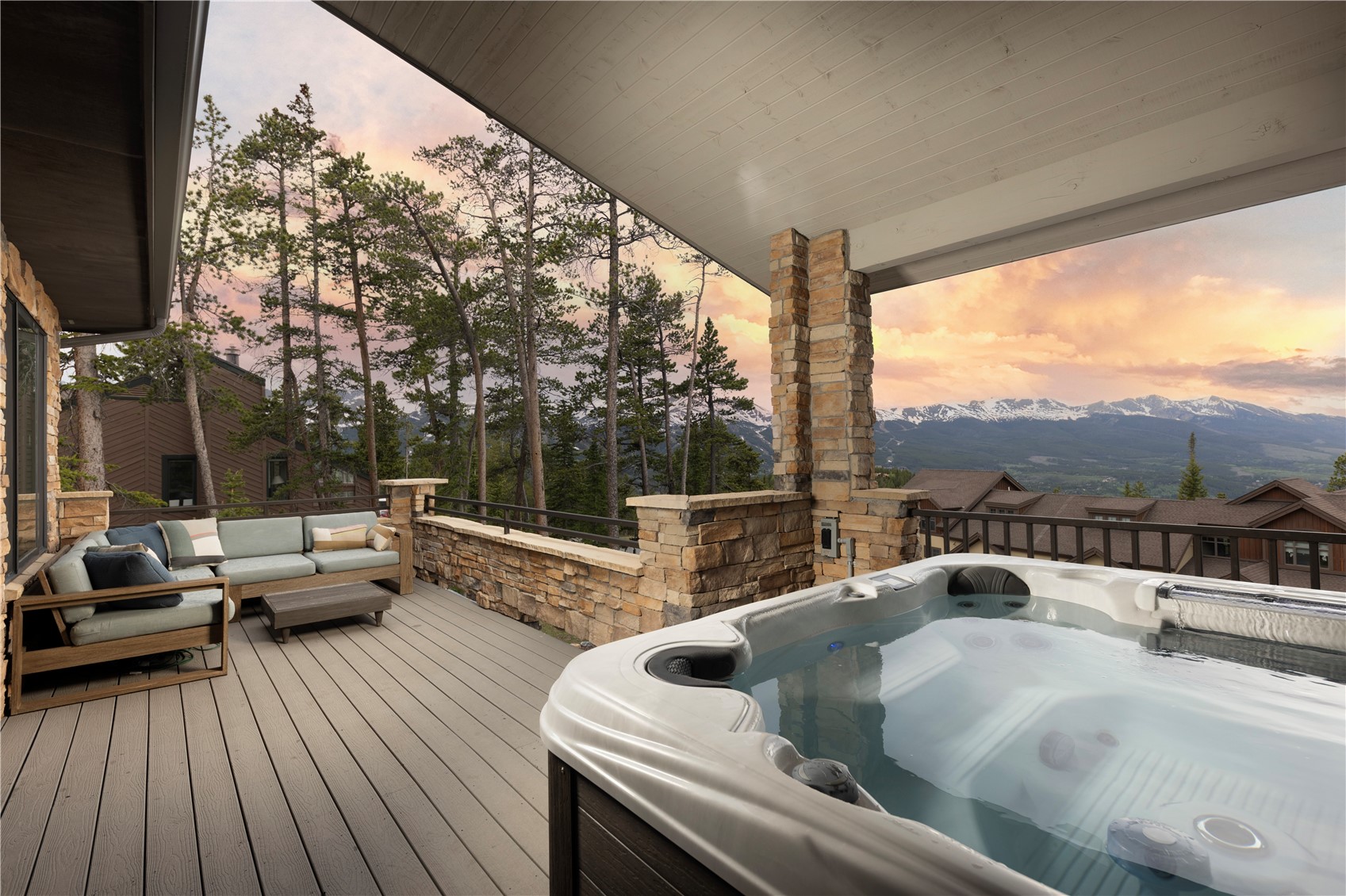 260 Fuller Placer Road Breckenridge, CO 80424 - Photo 2 of 32 a view of roof deck with couches and wooden floor