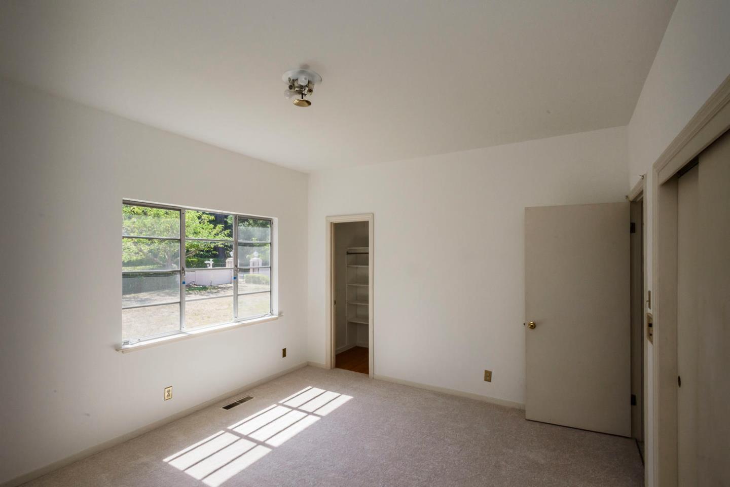 460 Pullman Road Hillsborough, CA 94010 - Photo 20 of 34 an empty room with windows