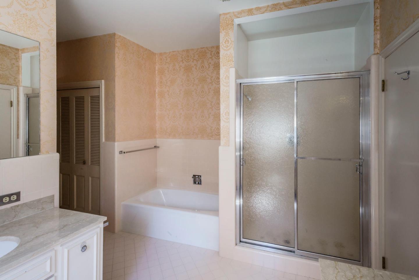 460 Pullman Road Hillsborough, CA 94010 - Photo 23 of 34 a bathroom with a bathtub and a sink