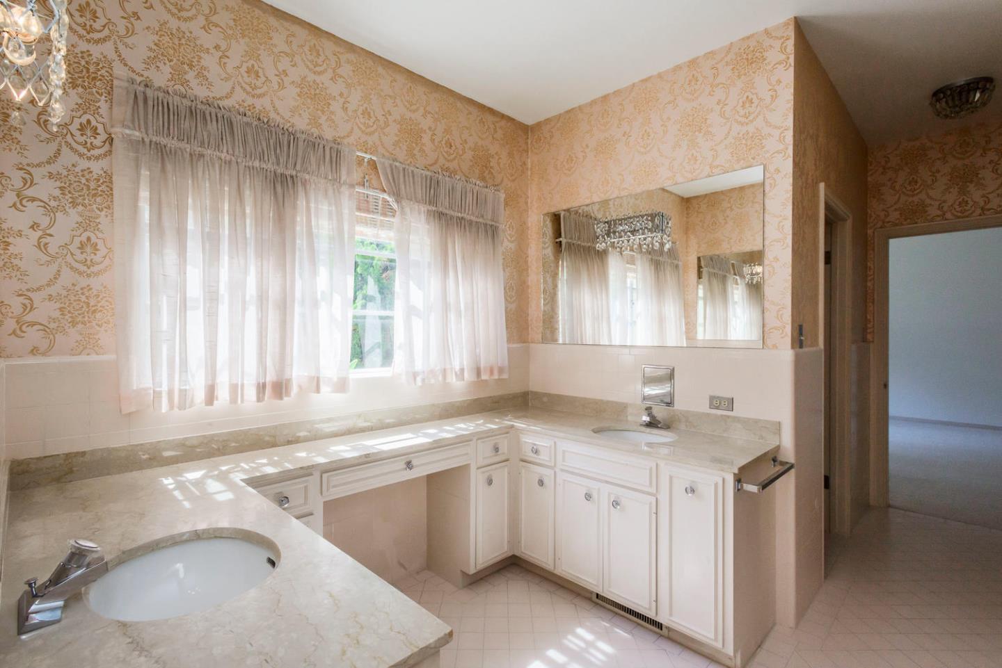 460 Pullman Road Hillsborough, CA 94010 - Photo 24 of 34 a bathroom with a sink vanity granite tub and a mirror