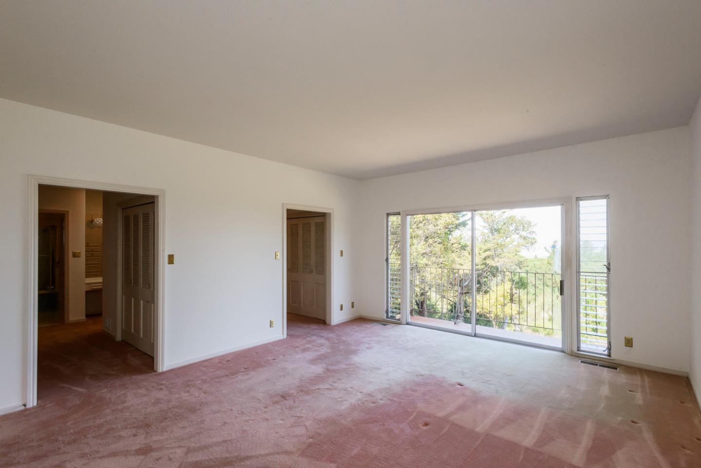 460 Pullman Road Hillsborough, CA 94010 - Photo 25 of 34 a view of an empty room with large windows