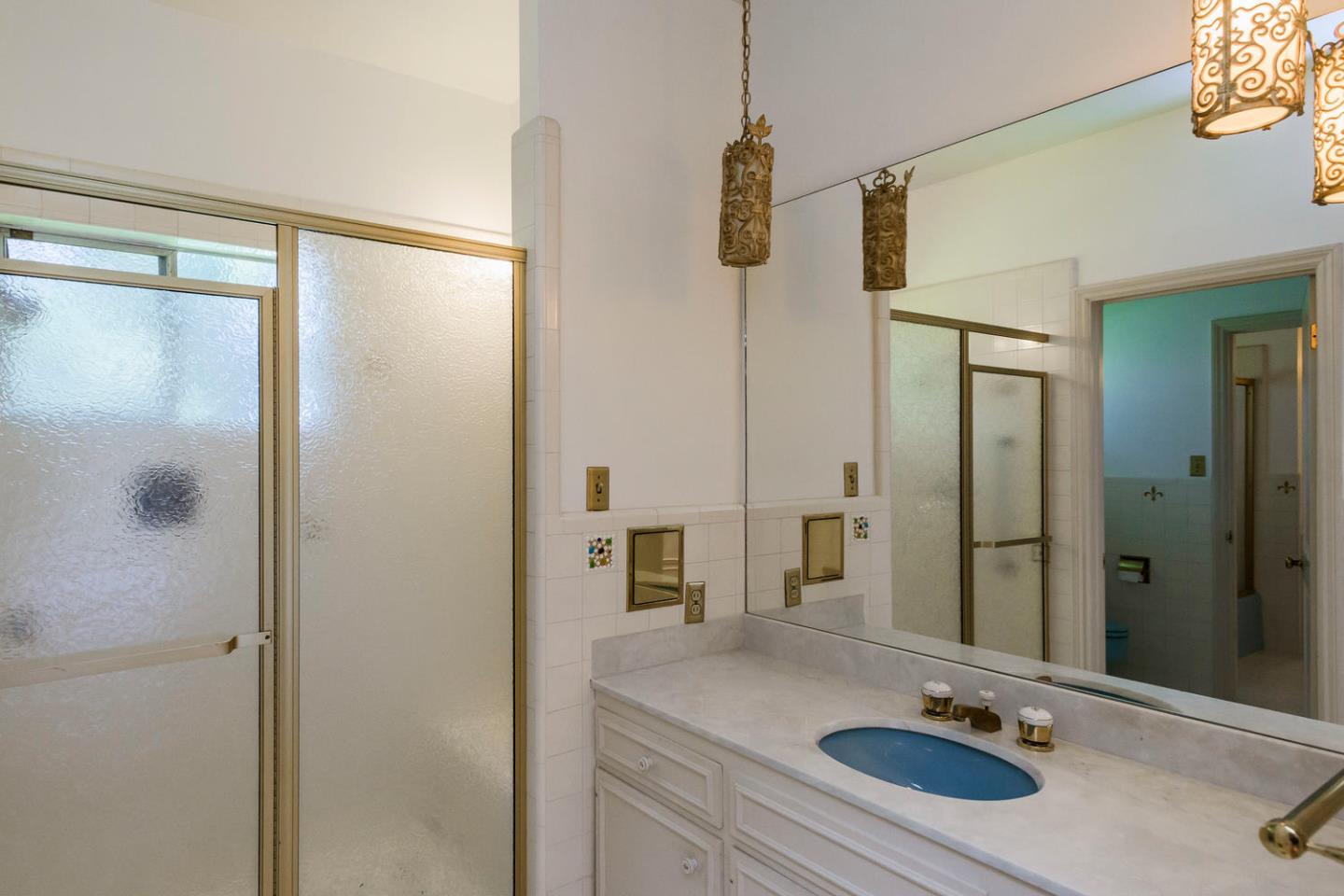 460 Pullman Road Hillsborough, CA 94010 - Photo 27 of 34 a bathroom with a sink and a mirror