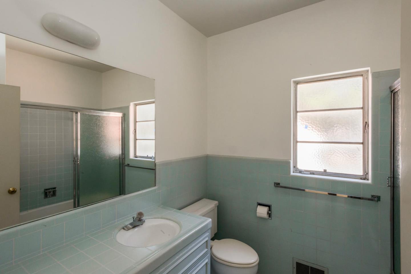 460 Pullman Road Hillsborough, CA 94010 - Photo 30 of 34 a bathroom with a sink toilet and shower