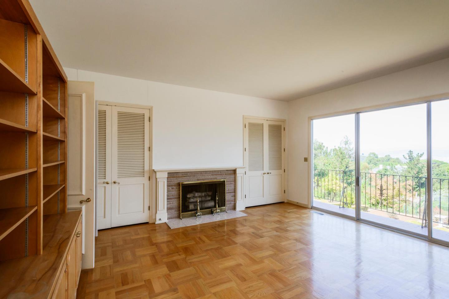 460 Pullman Road Hillsborough, CA 94010 - Photo 10 of 34 a view of an empty room with a window and fire place