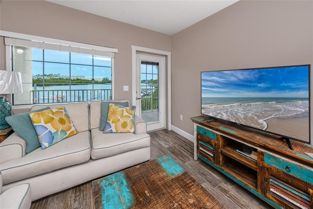 399 2nd Street, Unit 217 Indian Rocks Beach, FL 33785 - Photo 12 of 44 a living room with furniture and a rug