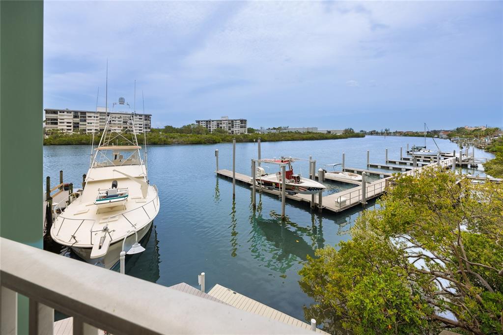 399 2nd Street, Unit 217 Indian Rocks Beach, FL 33785 - Photo 13 of 44 a view of a lake with a table and chairs