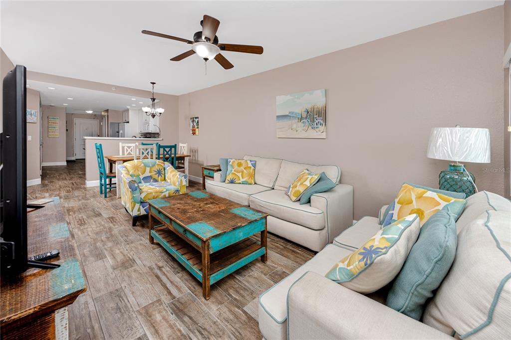 399 2nd Street, Unit 217 Indian Rocks Beach, FL 33785 - Photo 14 of 44 a living room with furniture and a flat screen tv