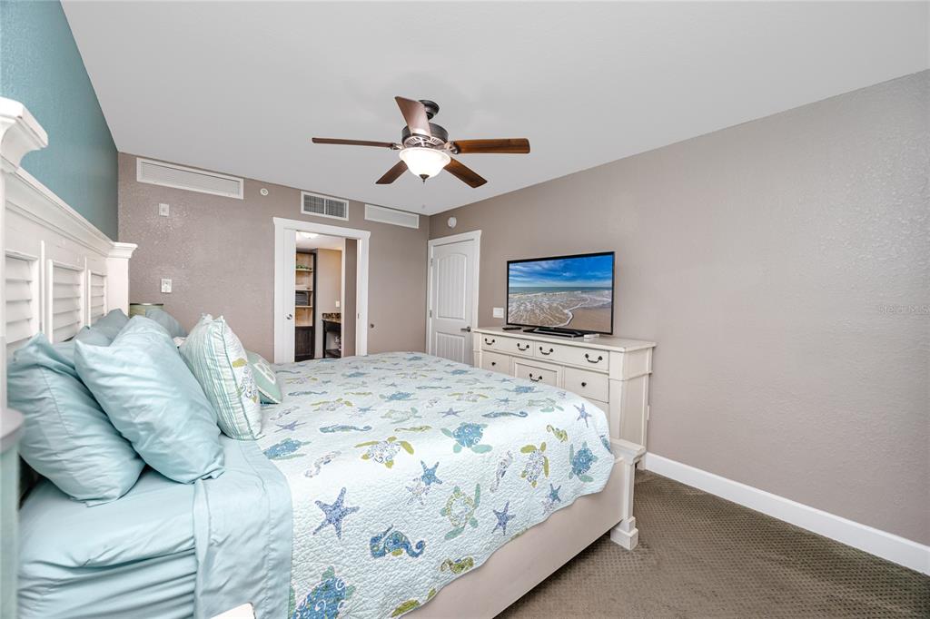 399 2nd Street, Unit 217 Indian Rocks Beach, FL 33785 - Photo 17 of 44 a bedroom with a bed and a tv