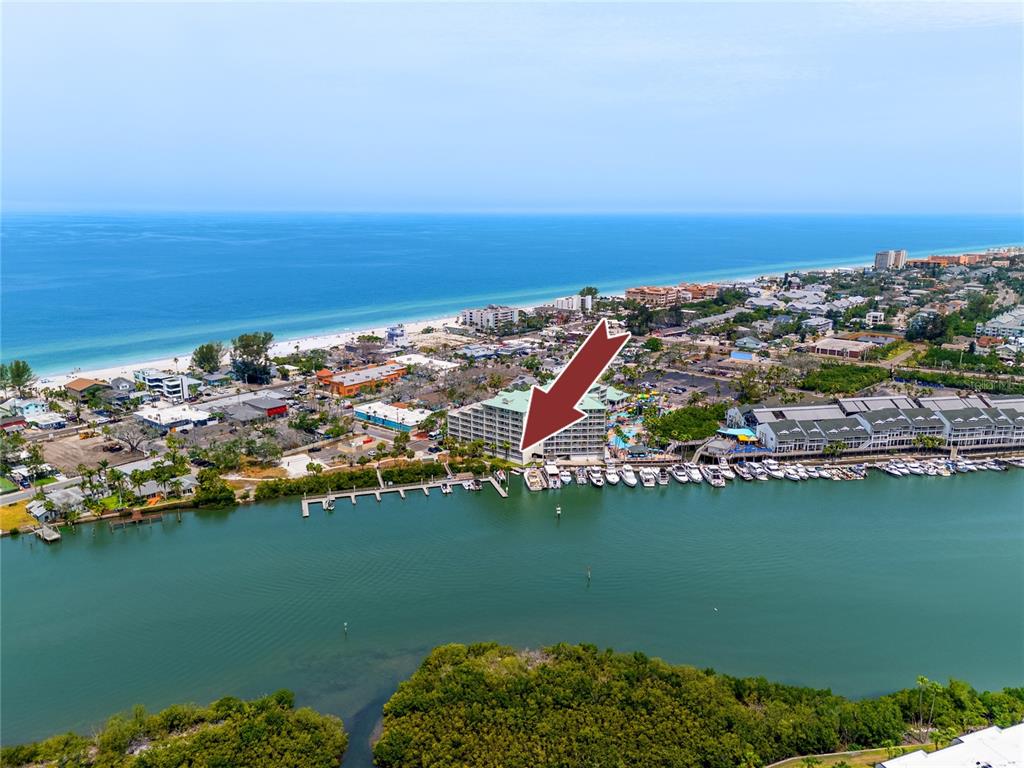 399 2nd Street, Unit 217 Indian Rocks Beach, FL 33785 - Photo 30 of 44 an aerial view of ocean and residential houses with outdoor space