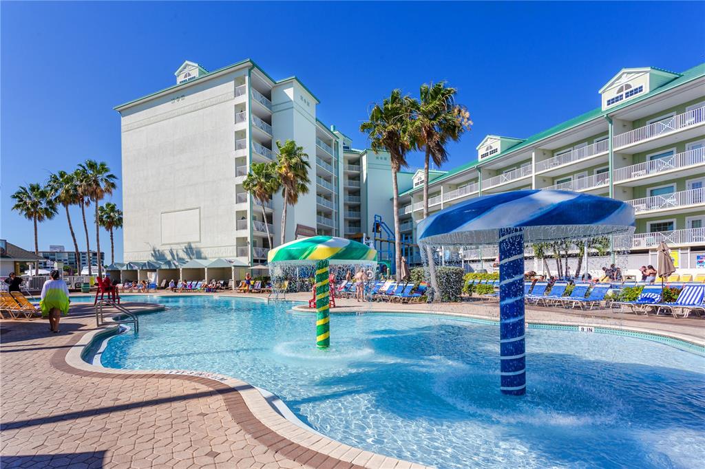 399 2nd Street, Unit 217 Indian Rocks Beach, FL 33785 - Photo 33 of 44 a view of a swimming pool with a patio