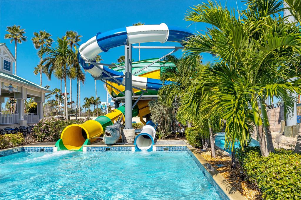 399 2nd Street, Unit 217 Indian Rocks Beach, FL 33785 - Photo 37 of 44 a view of a backyard with swimming pool and sitting area