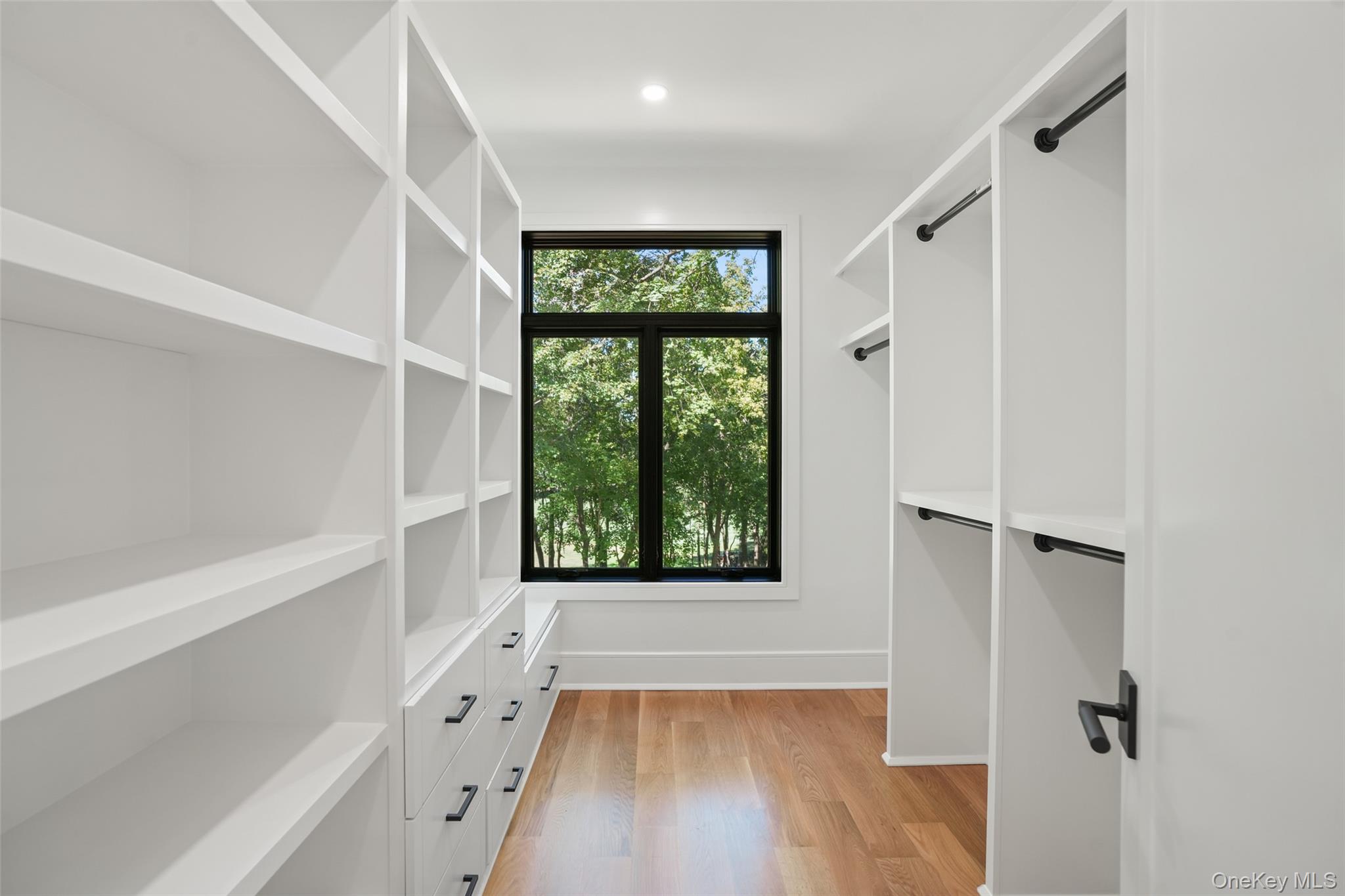 11 Boxwood Lane Rye, NY 10580 - Photo 16 of 29 a view of an empty room with a window and wooden floor