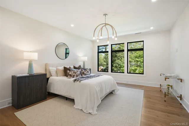 a bed room with a bed and a large window