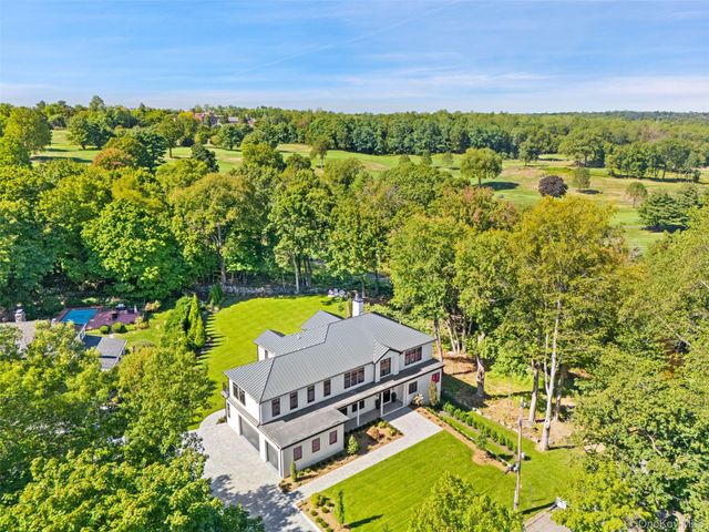 an aerial view of a house with a garden